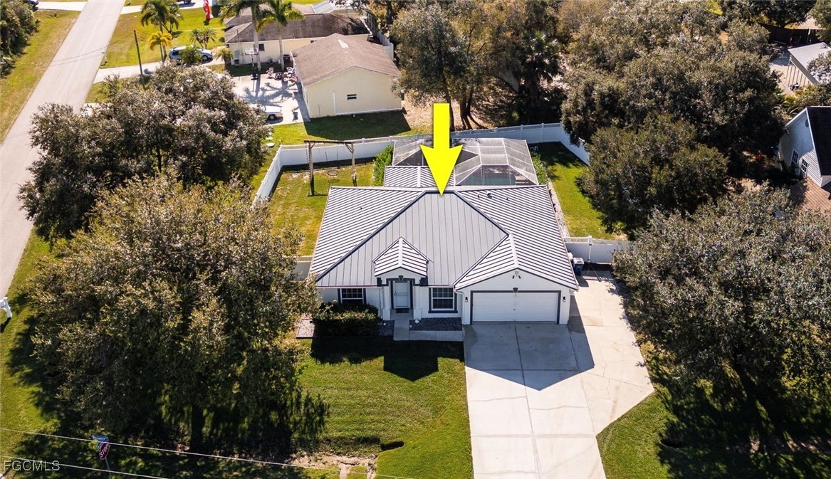 an aerial view of a house with swimming pool