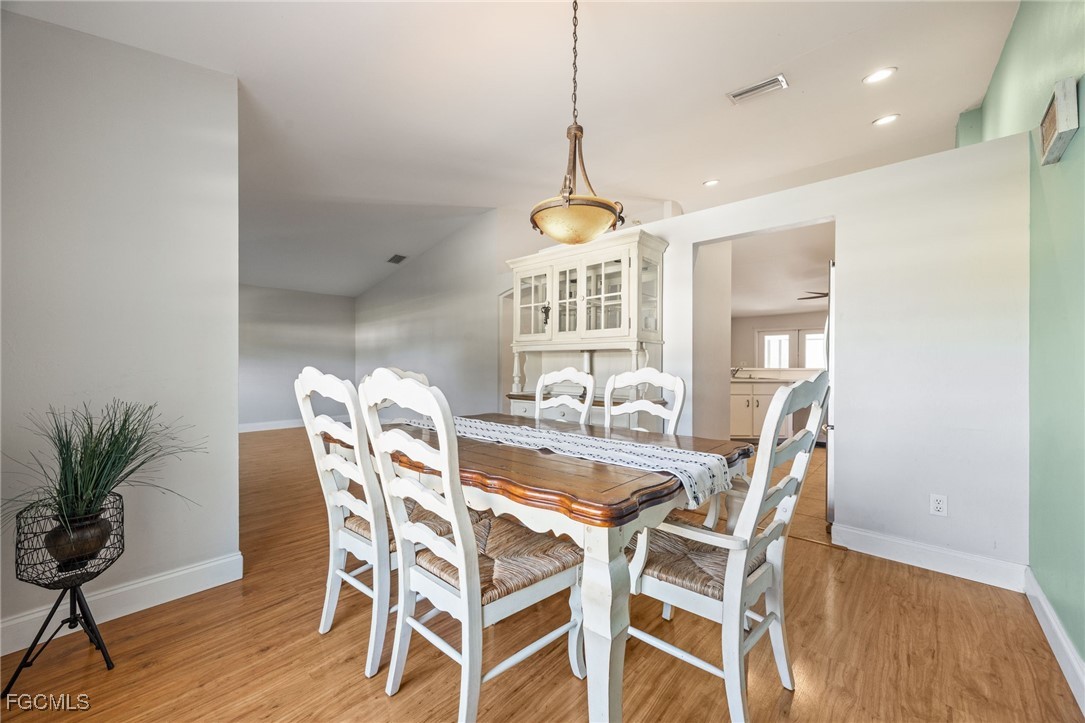 14150 Benedict Street Fort Myers, FL 33905 - Photo 12 of 31 a view of a dining room with furniture window and wooden floor