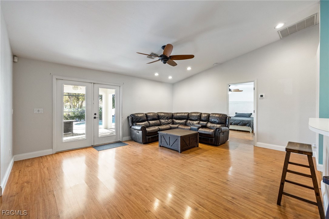14150 Benedict Street Fort Myers, FL 33905 - Photo 18 of 31 a living room with furniture fireplace and wooden floor