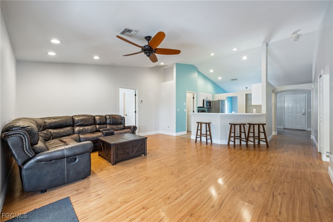 14150 Benedict Street Fort Myers, FL 33905 - Photo 19 of 31 a living room with furniture and a wooden floor