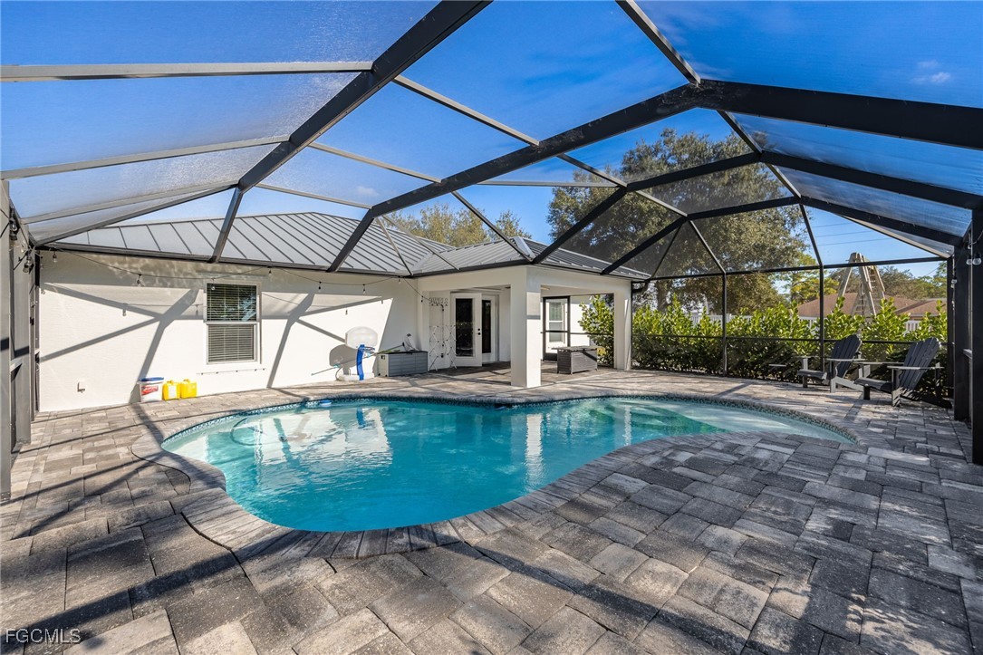 14150 Benedict Street Fort Myers, FL 33905 - Photo 29 of 31 a view of a swimming pool with a patio