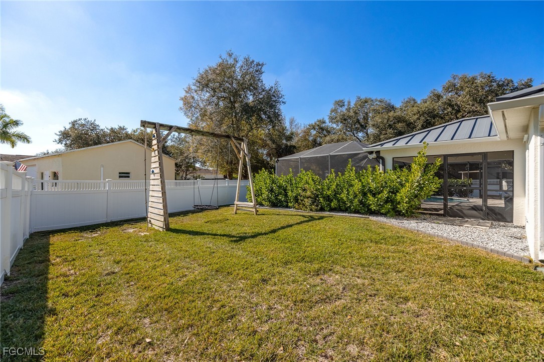 14150 Benedict Street Fort Myers, FL 33905 - Photo 5 of 31 a view of a house with backyard and tree