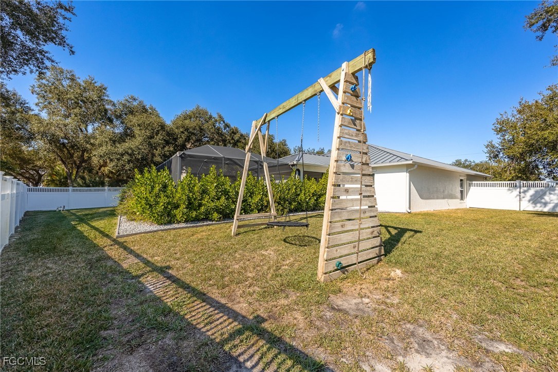 14150 Benedict Street Fort Myers, FL 33905 - Photo 6 of 31 a view of a house with a yard
