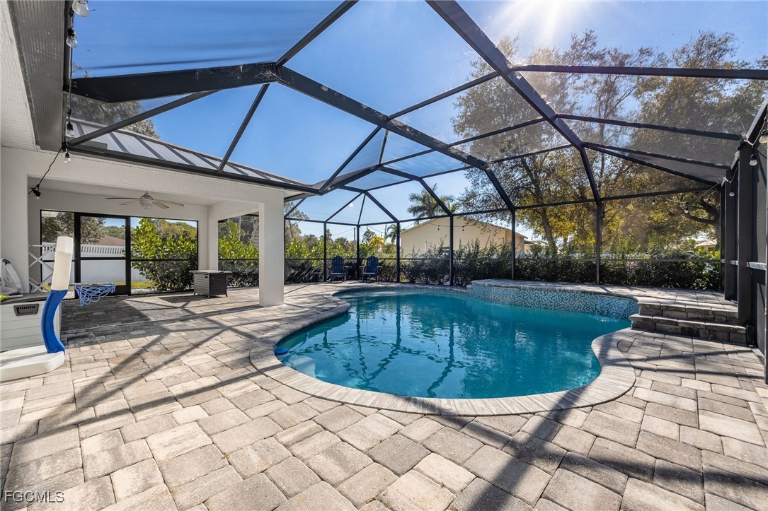 14150 Benedict Street Fort Myers, FL 33905 - Photo 8 of 31 a view of a backyard with sitting area