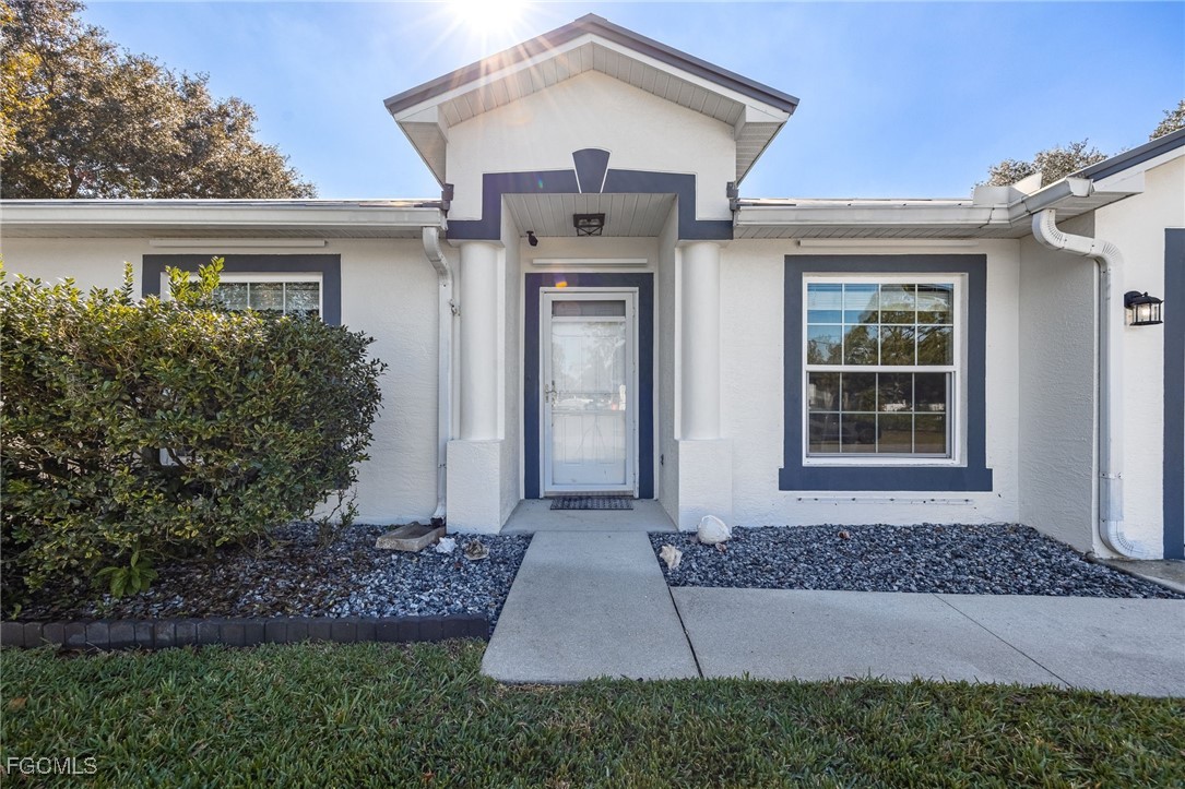 14150 Benedict Street Fort Myers, FL 33905 - Photo 9 of 31 front view of a house with a yard