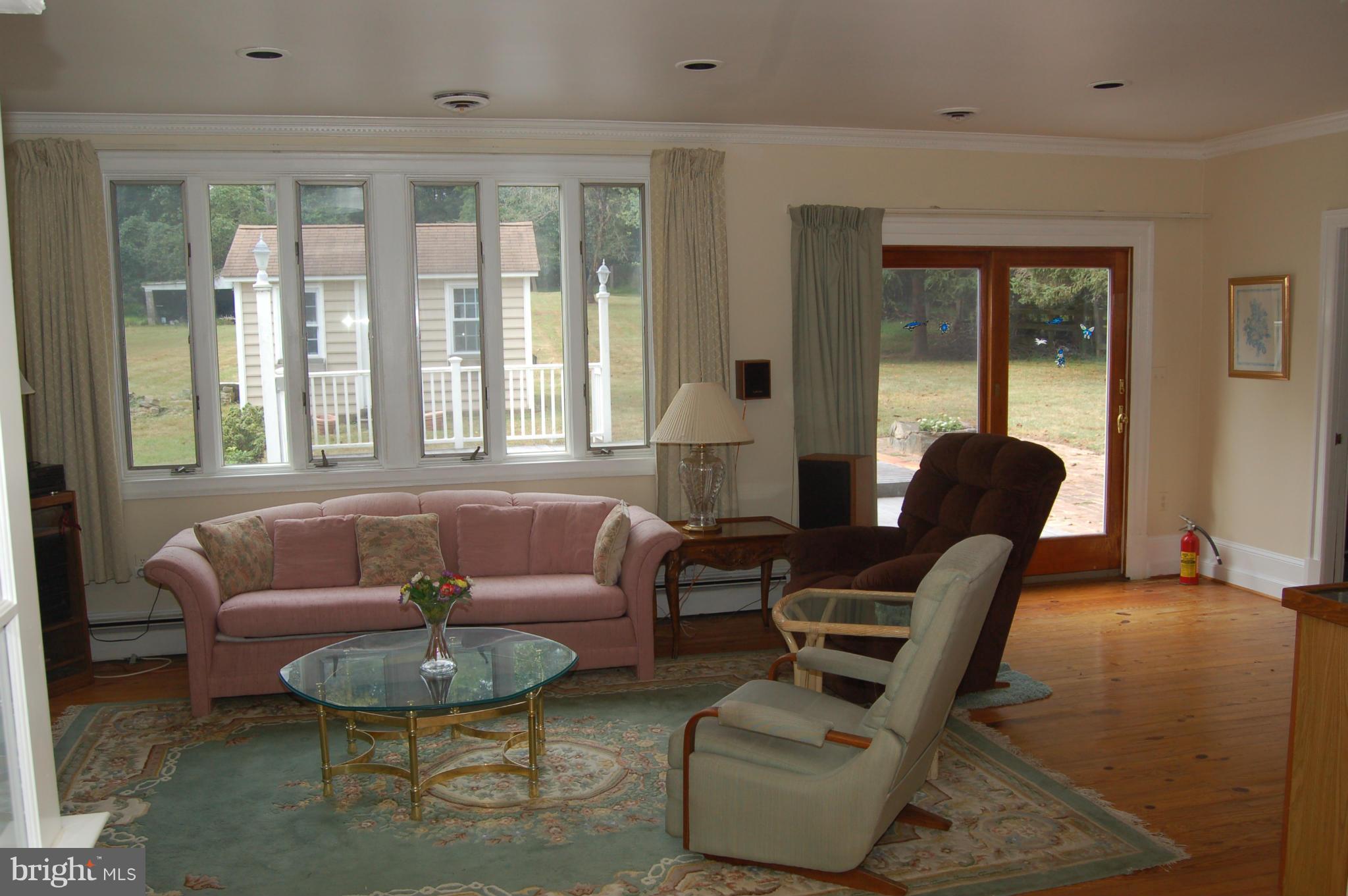 8712 Brickyard Road Potomac, MD 20854 - Photo 13 of 30 a living room with furniture and a large window