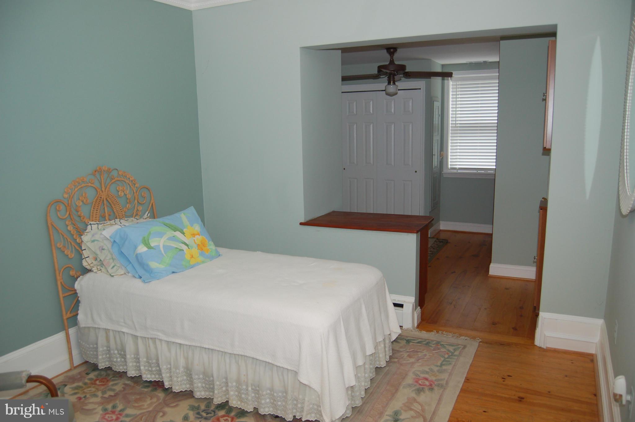 8712 Brickyard Road Potomac, MD 20854 - Photo 15 of 30 a bedroom with a bed and a table
