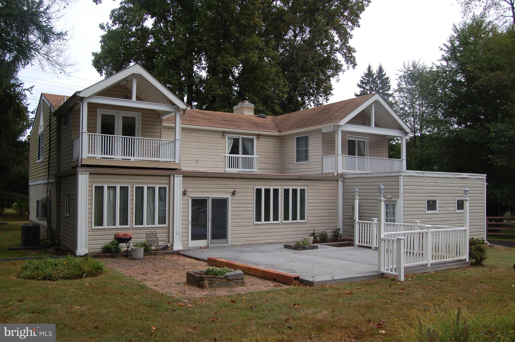 8712 Brickyard Road Potomac, MD 20854 - Photo 3 of 30 front view of a house with a yard