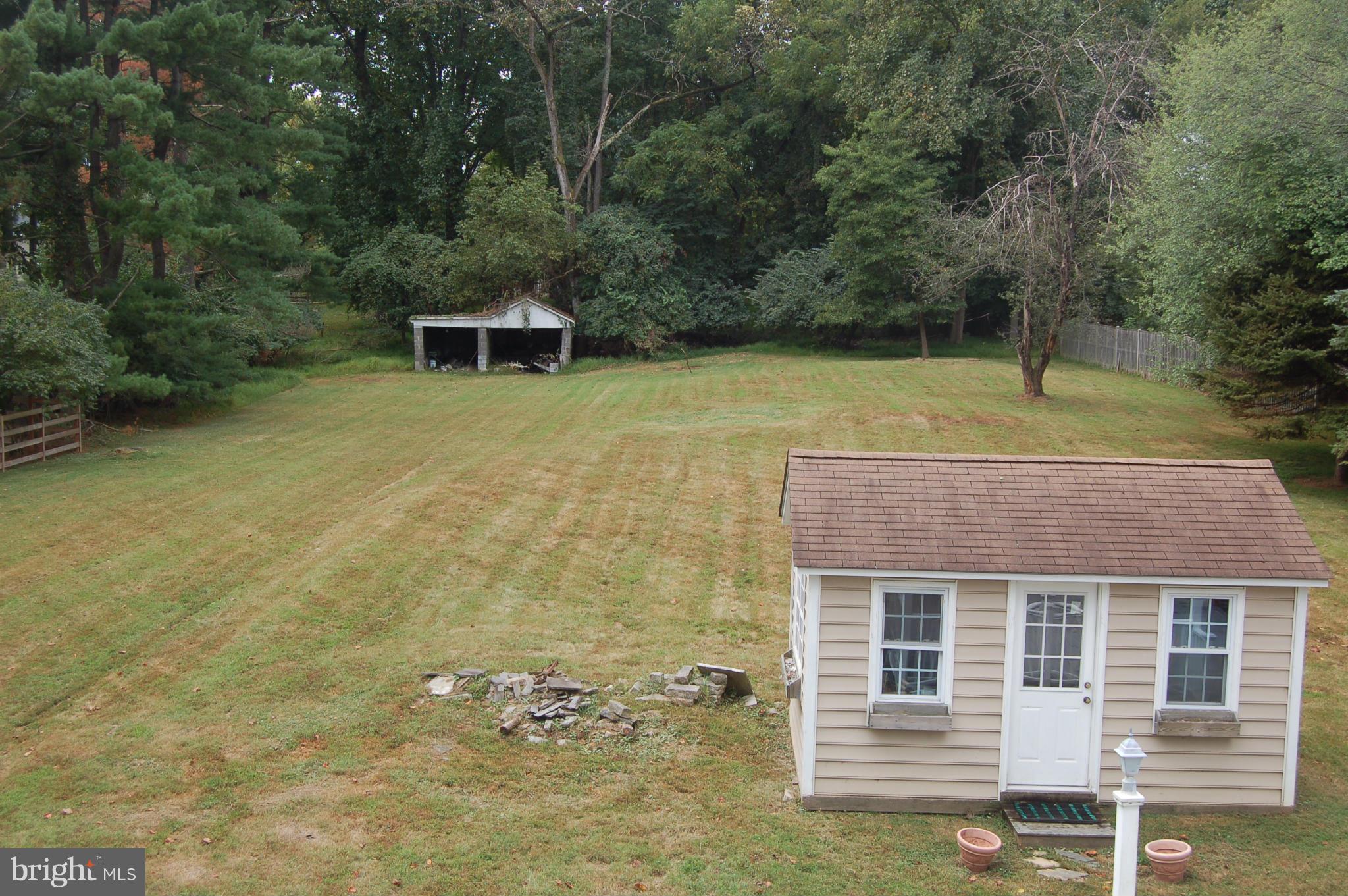 8712 Brickyard Road Potomac, MD 20854 - Photo 28 of 30 a front view of a house with a yard
