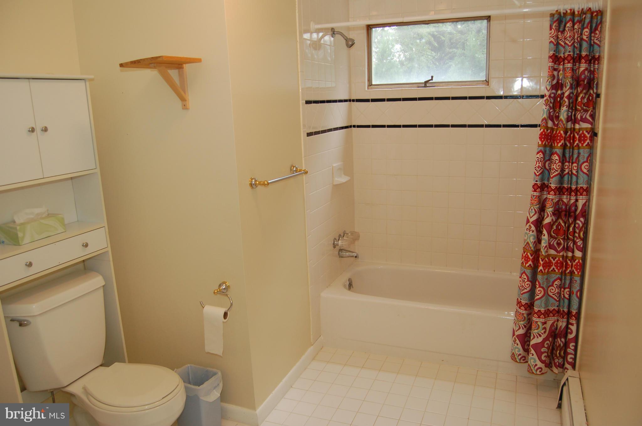 8712 Brickyard Road Potomac, MD 20854 - Photo 29 of 30 a white toilet sitting next to a bath tub