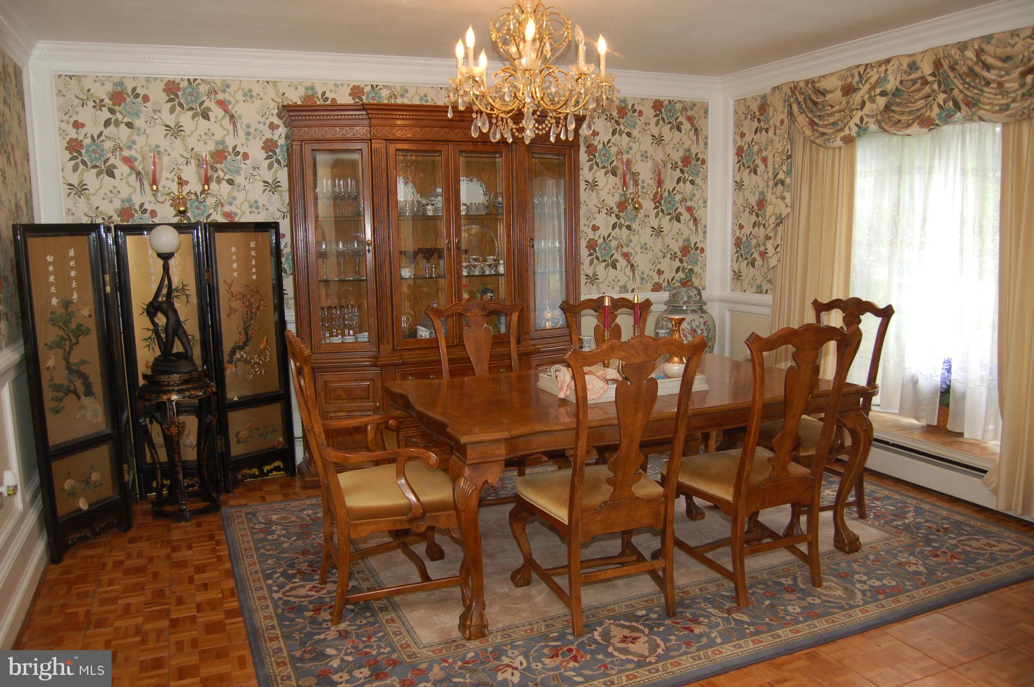 8712 Brickyard Road Potomac, MD 20854 - Photo 6 of 30 a view of a dining room with furniture and chandelier