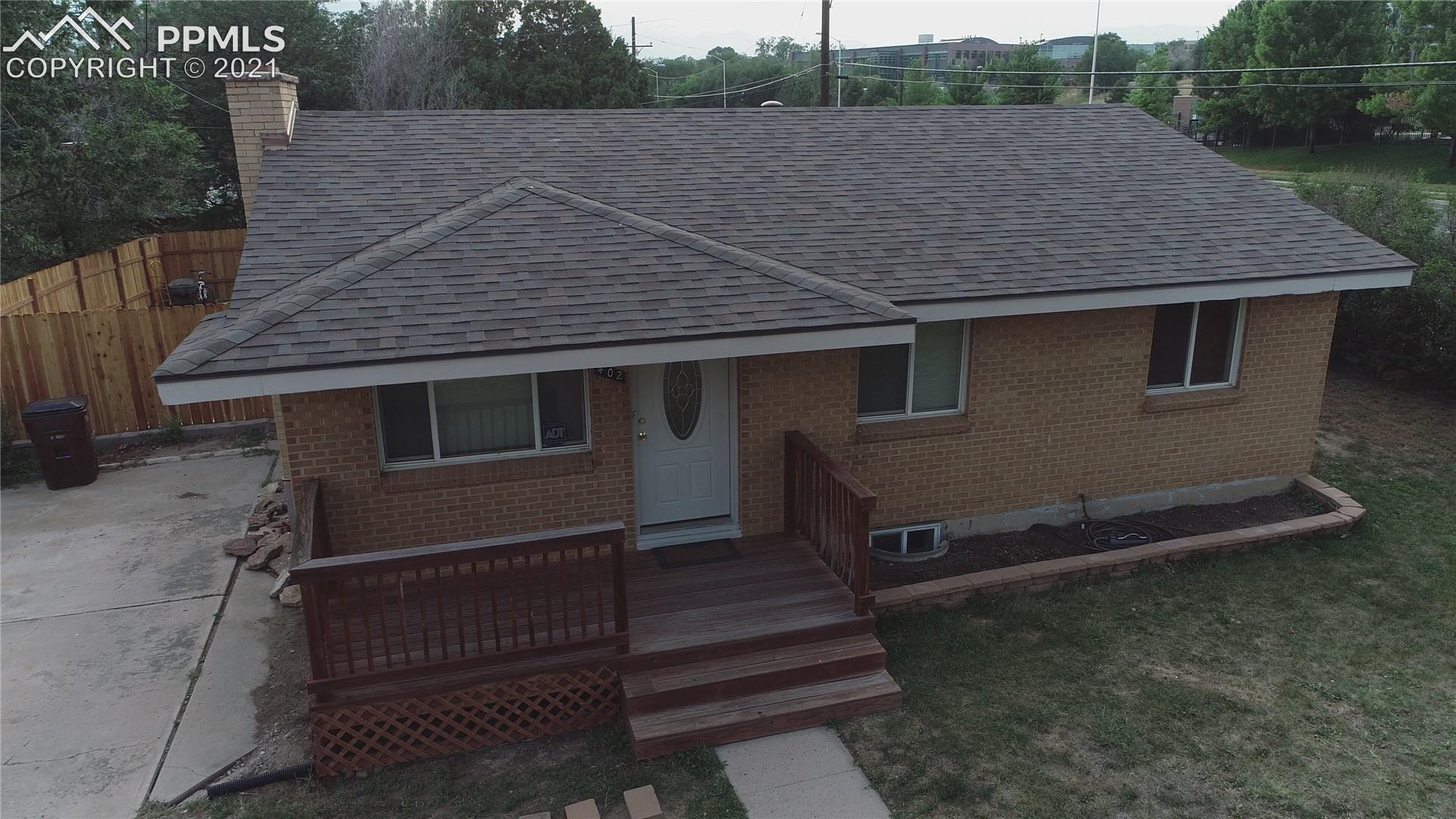 402 Yellowstone Road Colorado Springs, CO 80910 - Photo 1 of 28 Front of Home - New Roof