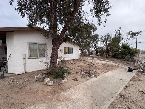 a house with trees in the background
