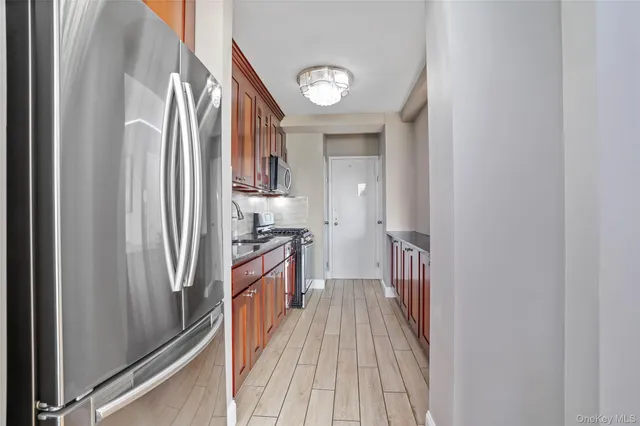 a view of a kitchen from the hallway