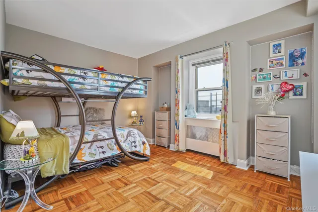 a bedroom with furniture and a window