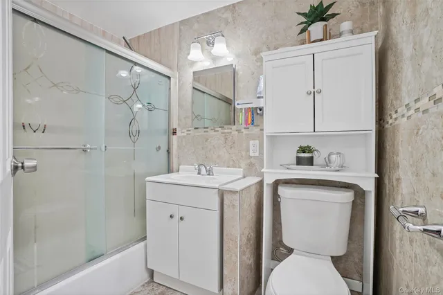 a view of bathroom with a sink toilet and shower