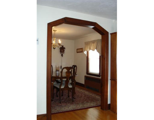 91 Thornton Road Waltham, MA 02453 - Photo 7 of 13 a view of a hallway and dining room with a large mirror