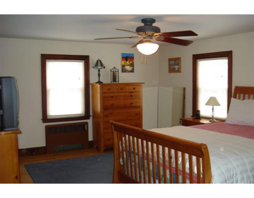 91 Thornton Road Waltham, MA 02453 - Photo 9 of 13 a bedroom with a bed and a window