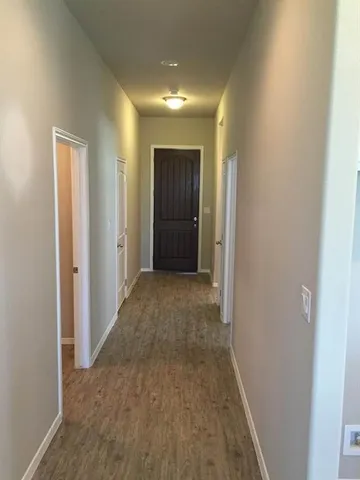 a view of a hallway with an empty room