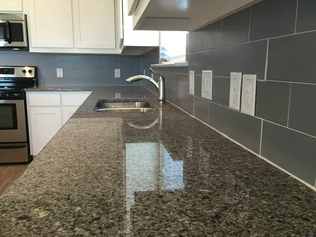 a kitchen with a sink and cabinets
