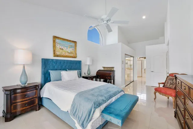 a bathroom with a double vanity sink a large mirror and a bathtub