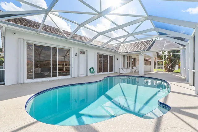 a view of a swimming pool with a patio