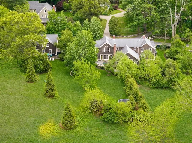 a aerial view of a house with a yard
