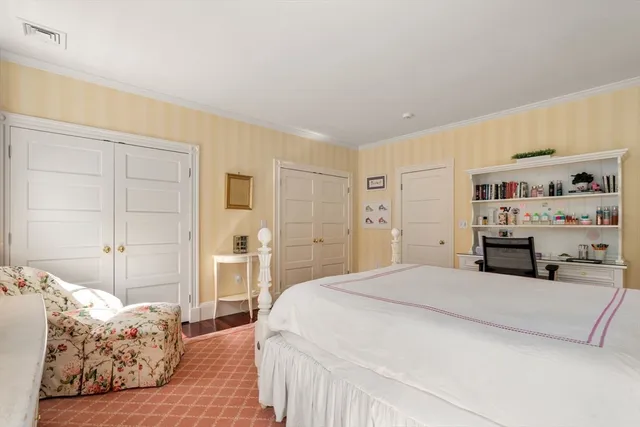 a bedroom with a bed and a cabinets