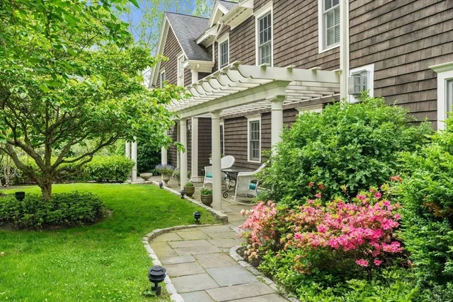 a front view of a house with garden
