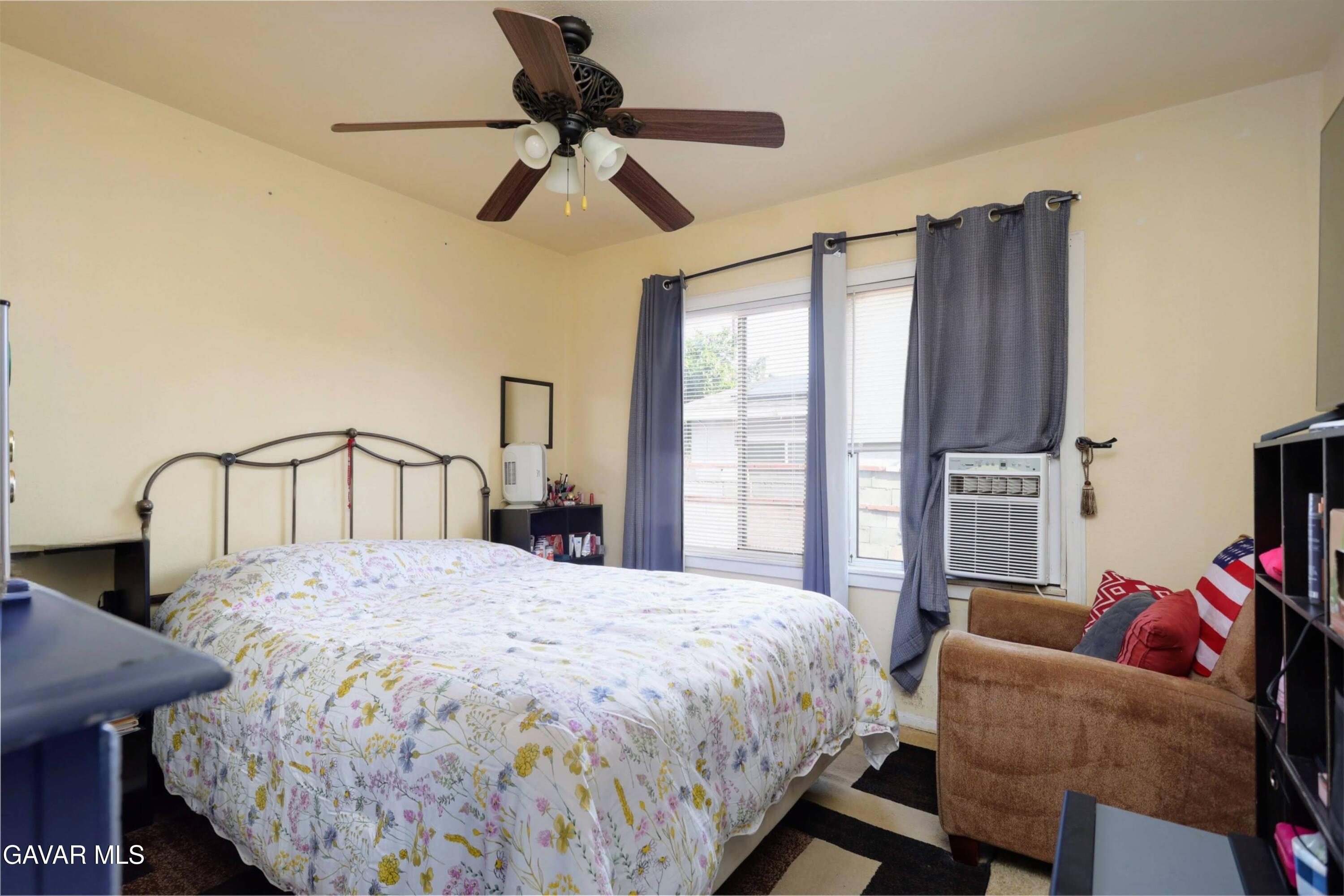 44265 Foxton Avenue Lancaster, CA 93535 - Photo 14 of 20 a bedroom with a bed furniture and a window
