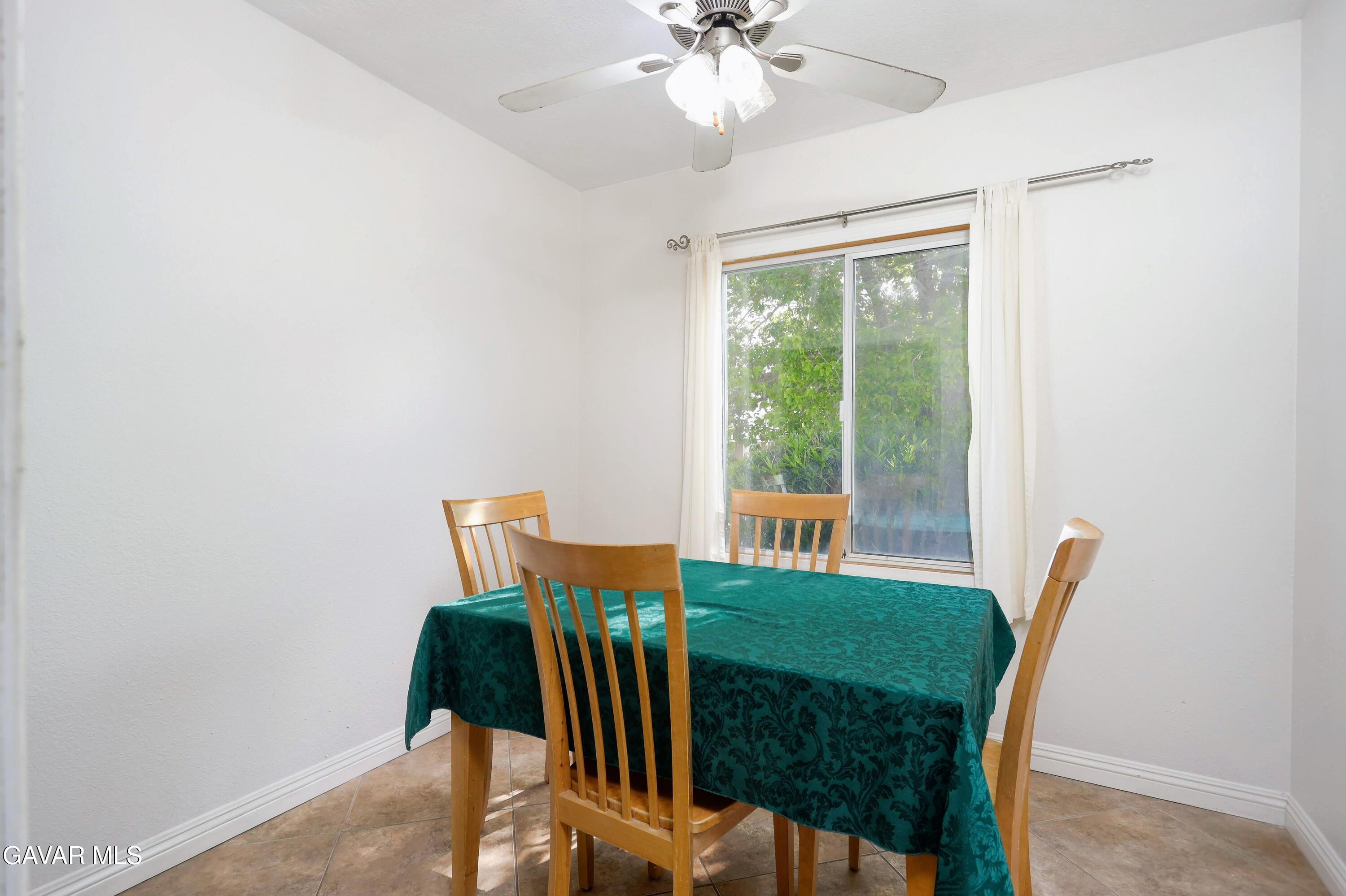 44265 Foxton Avenue Lancaster, CA 93535 - Photo 18 of 20 a view of a dining room with furniture window and outside view