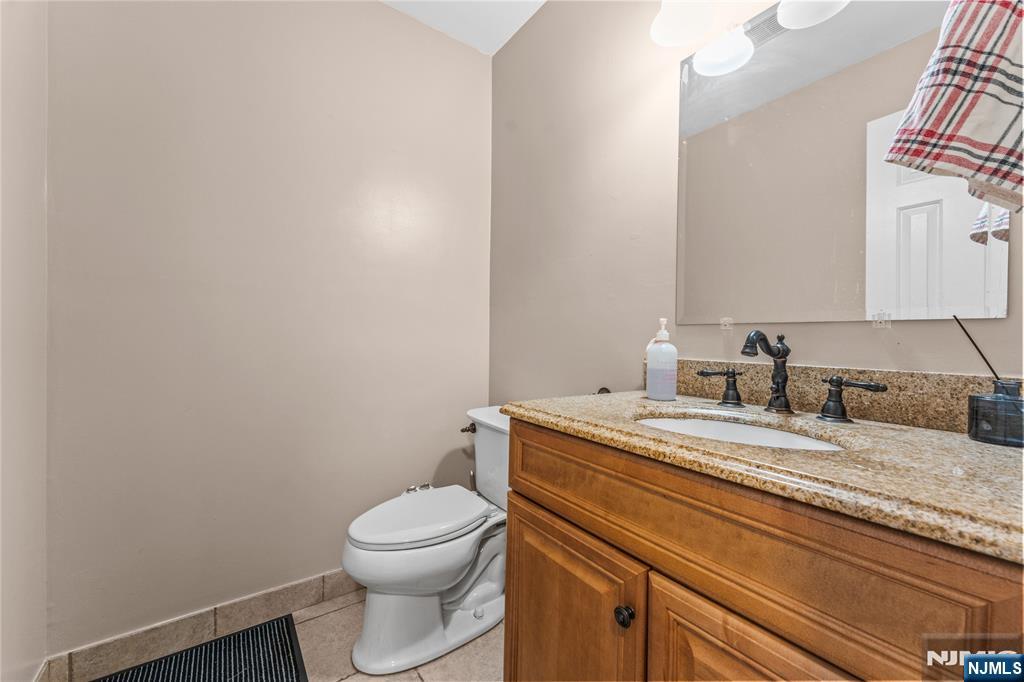123 Butternut Drive Wayne, NJ 07470 - Photo 12 of 23 a bathroom with a granite countertop toilet and sink