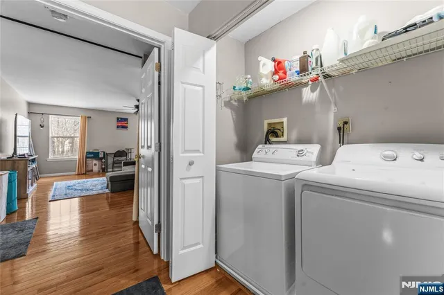 a view of storage and utility room with washer and dryer