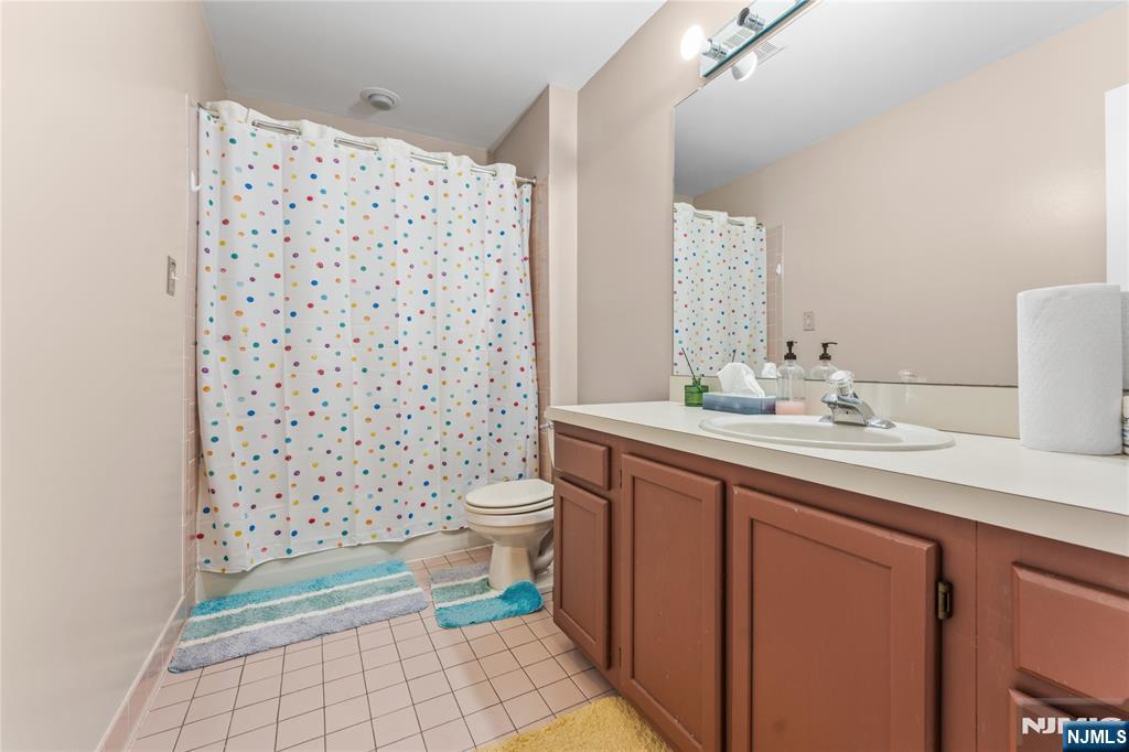 123 Butternut Drive Wayne, NJ 07470 - Photo 20 of 23 a bathroom with a sink toilet and shower