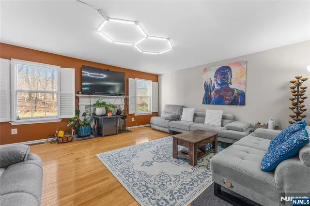 a living room with furniture fireplace and window