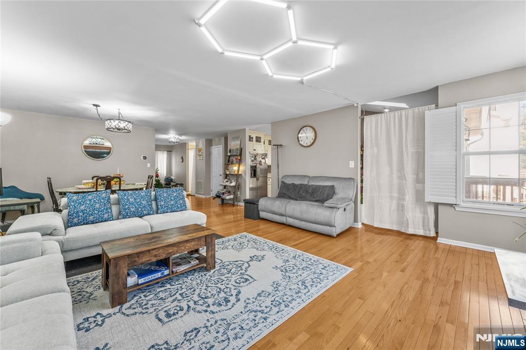 123 Butternut Drive Wayne, NJ 07470 - Photo 6 of 23 a living room with furniture and a rug