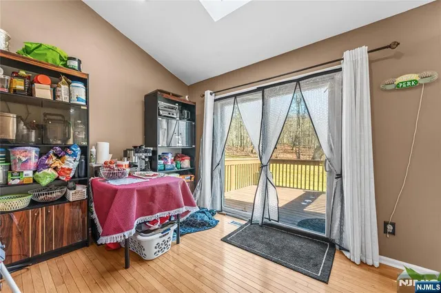 a view of living room filled with furniture and floor to ceiling window