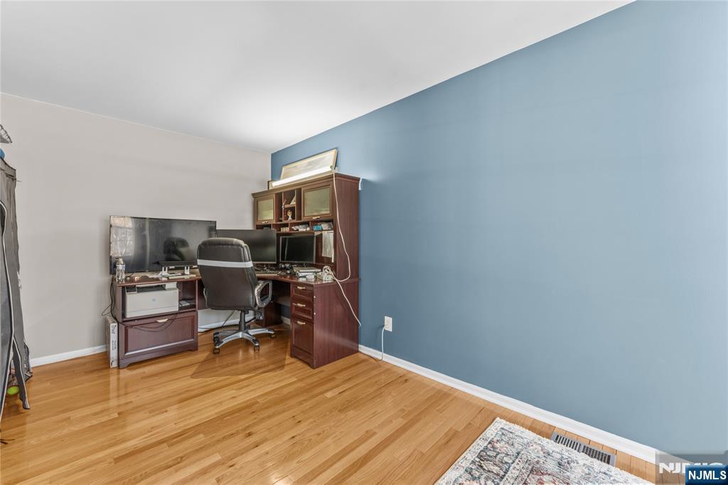 123 Butternut Drive Wayne, NJ 07470 - Photo 10 of 23 a workspace with furniture and wooden floor
