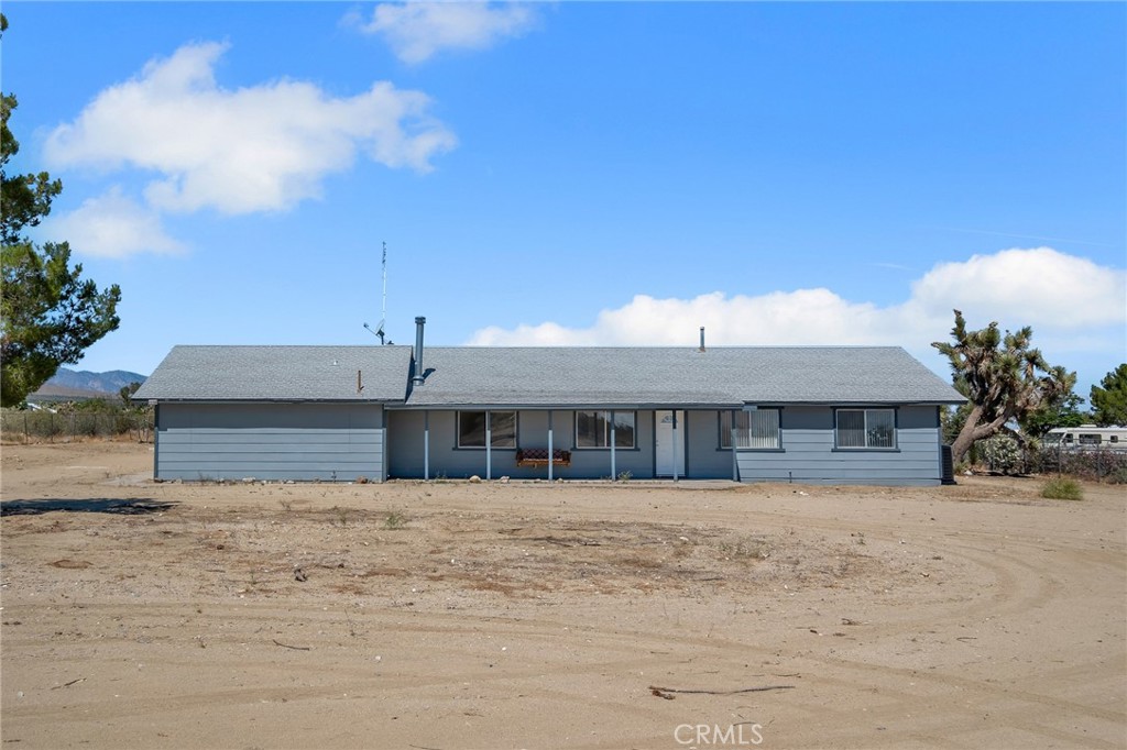 12736 Oasis Road Pinon Hills, CA 92372 - Photo 2 of 33 a front view of a house with a yard