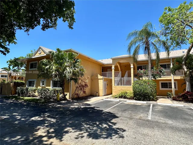 a view of a building with a yard