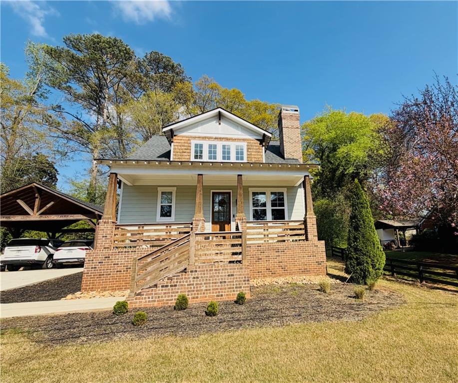 a front view of a house with a porch