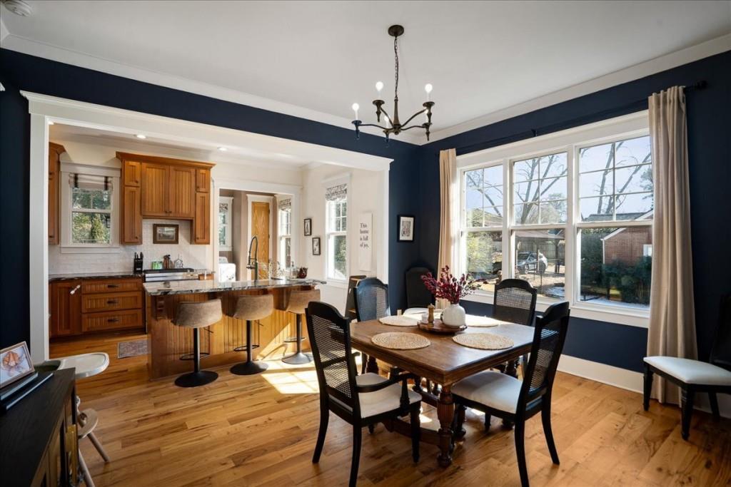 435 Walton Street Monroe, GA 30655 - Photo 11 of 55 a view of a dining room with furniture window and wooden floor