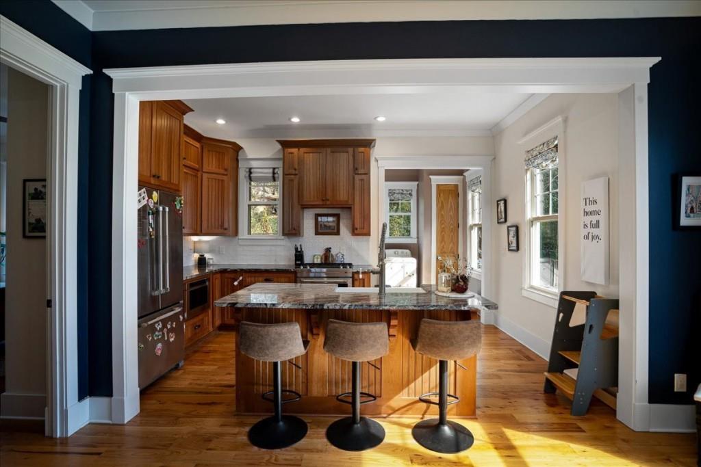 435 Walton Street Monroe, GA 30655 - Photo 14 of 55 a room with furniture and wooden floor