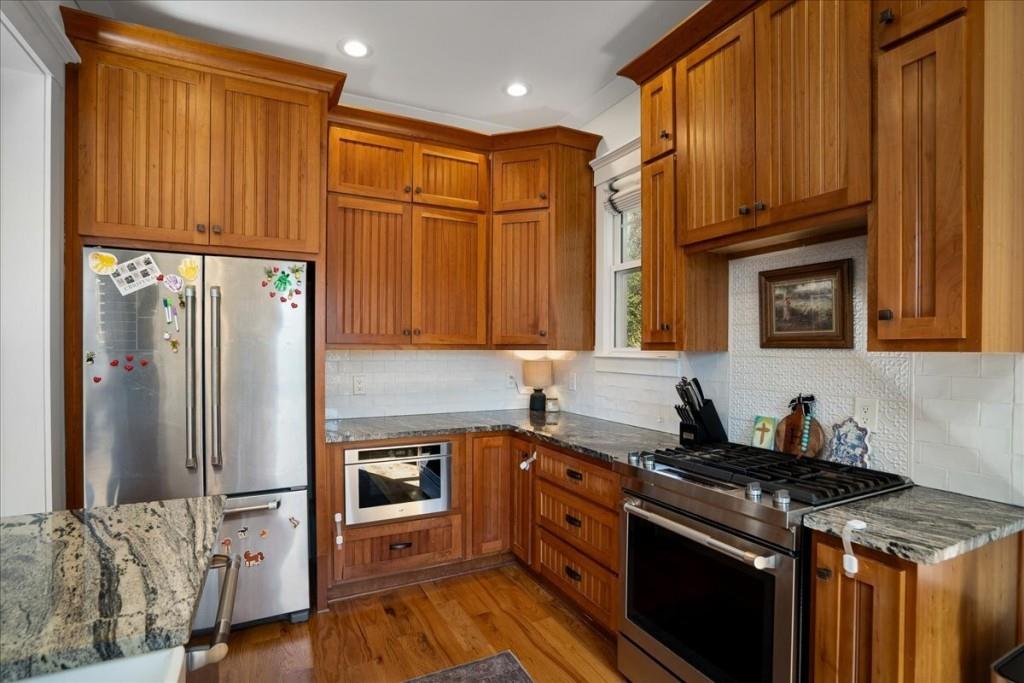 435 Walton Street Monroe, GA 30655 - Photo 17 of 55 a kitchen with stainless steel appliances granite countertop a refrigerator stove and sink