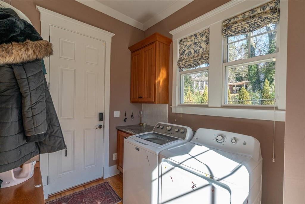 435 Walton Street Monroe, GA 30655 - Photo 19 of 55 a room that has a bed and a chair in it