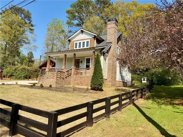 a view of a backyard of the house