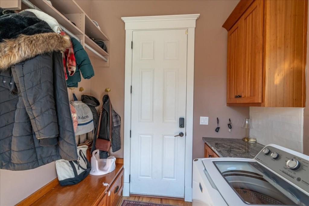 435 Walton Street Monroe, GA 30655 - Photo 28 of 55 a view of walk in closet with clothes and shoes