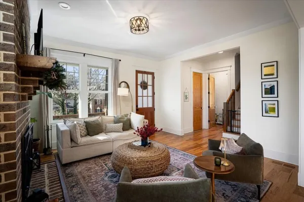 a view of a dining room with furniture window and wooden floor