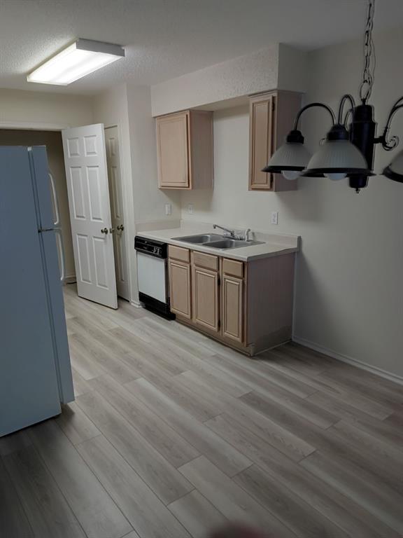 113 South Summit Street Red Oak, TX 75154 - Photo 4 of 4 a kitchen with stainless steel appliances granite countertop a sink stove and refrigerator