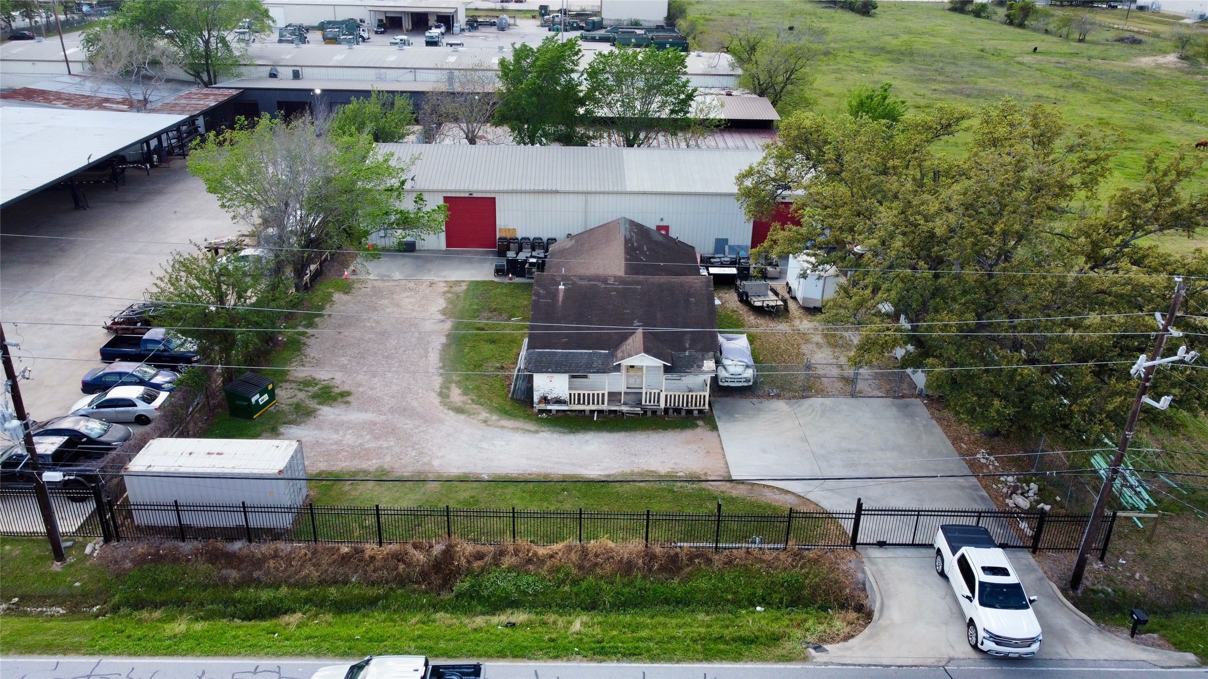 6951 Windfern Road Houston, TX 77040 - Photo 2 of 8 a aerial view of a house with a yard and garden
